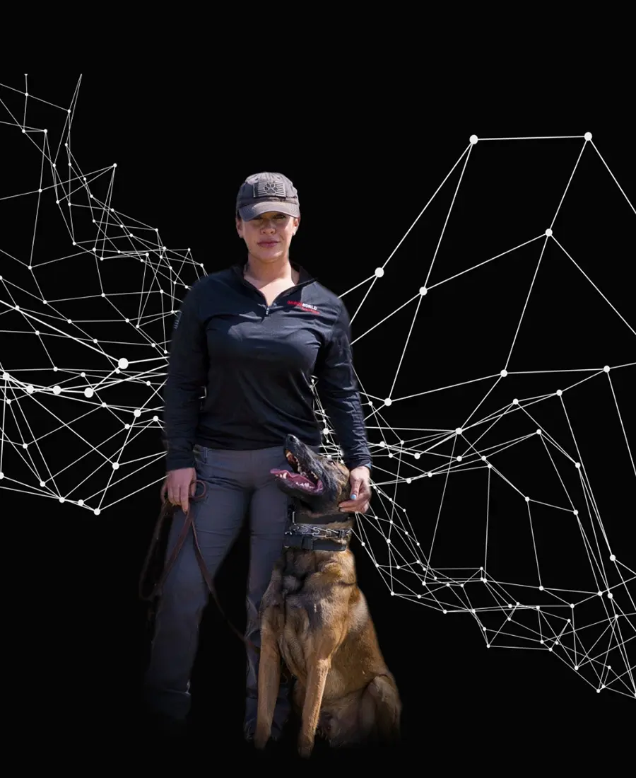 A GardaWorld Federal canine handler and their Belgian Malinois, poised for duty.